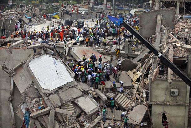 Bangladeshi rescuers work at the site of a building that collapsed Wednesday in Savar, near Dhaka, Bangladesh, Thursday, April 25, 2013. By Thursday, the death toll reached at least 194 people as rescuers continued to search for injured and missing, after a huge section of an eight-story building that housed several garment factories splintered into a pile of concrete.(AP Photo/A.M. Ahad)