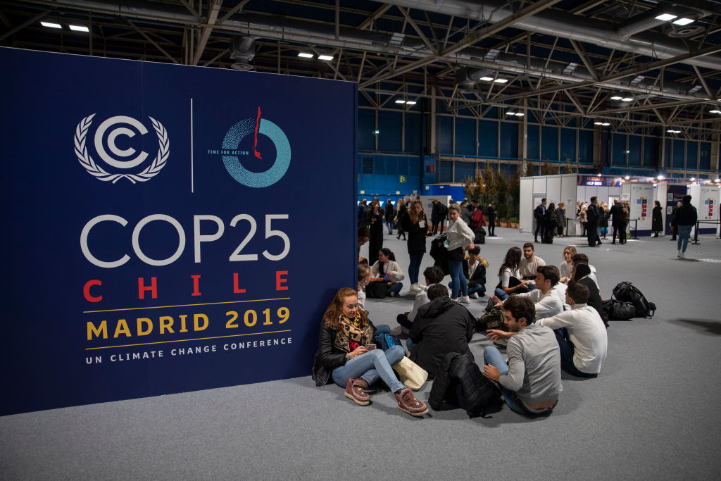 MADRID, SPAIN - DECEMBER 02: People sit on the ground during the opening day of the UNFCCC COP25 climate conference on December 2, 2019 in Madrid, Spain. The conference brings together world leaders, climate activists, NGOs, indigenous people and others together for two weeks in an effort to focus global policy makers on concrete steps for heading off a further rise in global temperatures. (Photo by Pablo Blazquez Dominguez/Getty Images)