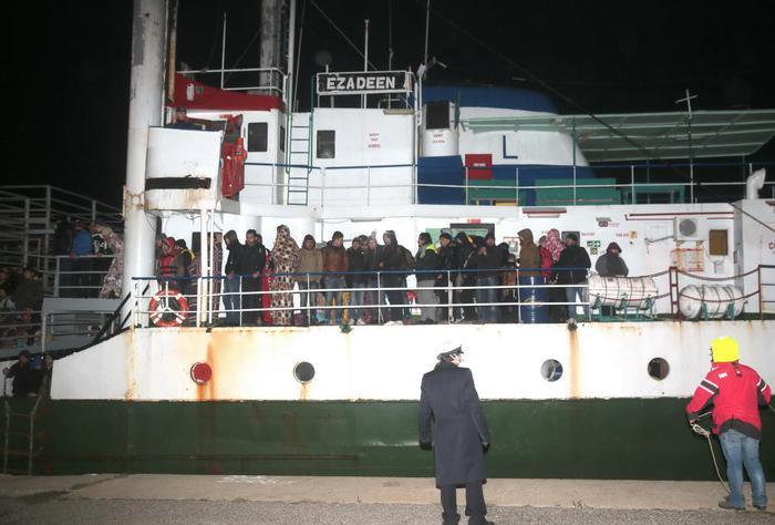 The cargo ship Ezadeen, carrying hundreds of migrants, arrives at the southern Italian port of Corigliano, Italy, late Friday, Jan. 2, 2015. The cargo ship was stopped with about 450 migrants aboard after smugglers sent it speeding toward the coast in rough seas with no one in command. Italian authorities lowered engineers and electricians onto the wave-tossed ship by helicopter to secure it, and the Icelandic Coast Guard towed it to the Italian port of Corigliano late Friday night. Smugglers who bring migrants to Europe by sea appear to have adopted a new, more dangerous tactic: cramming hundreds of them onto a large cargo ship, setting it on an automated course to crash into the coast, and then abandoning the helm. (AP Photo/Antonino D'Urso) [Credit: ANSA]